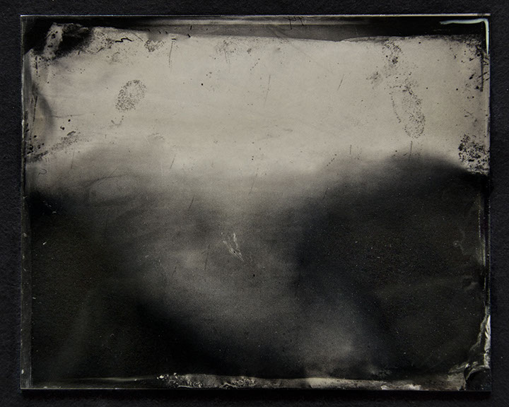 Bright fog swarms the middle. Crisp dark fingerprints at the edges. Brush strokes of silver ripple like water. Darks amass into trees or nothing