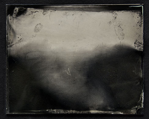 Bright fog swarms the middle. Crisp dark fingerprints at the edges. Brush strokes of silver ripple like water. Darks amass into trees or nothing