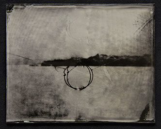 Landscape becomes abstract field of bright silver /w moire pattern. Dark fine gestures form a circle @ctr intersected by broad stroke of horizon