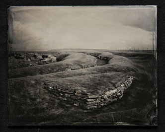 Panel A2 is a grassy landscape graced with waving mounds & stone buildings. Two walls of bricks meet to support the large mound in foreground.